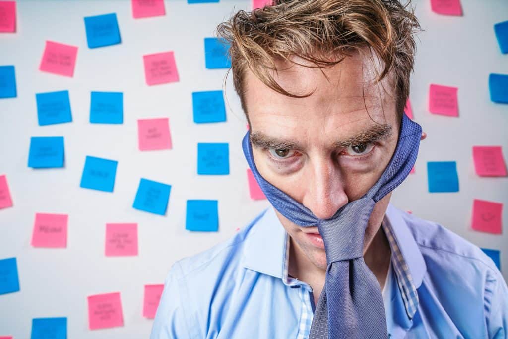 stressed businessperson with post it notes