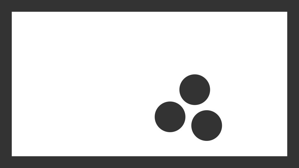 three circles grouped in bottom right corner of a white field illustrating the design element of space and Gestalt